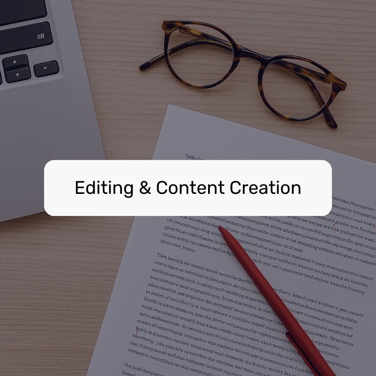 Flat lay of laptop, glasses, and a marked-up document with a red pen, labeled "Editing & Content Creation."